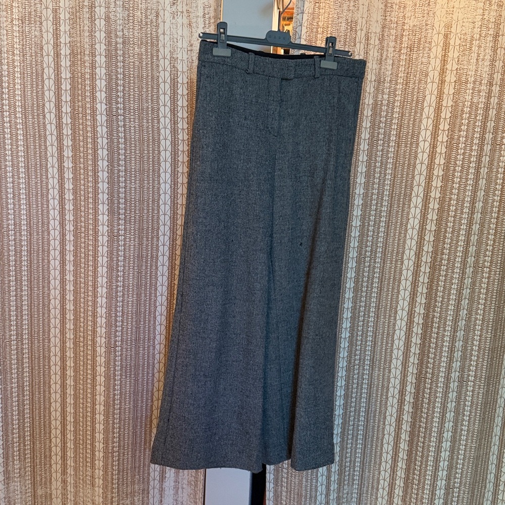 Maje wide-legged trousers in black and white tweed.